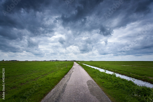 Road with dramatic blue clo...
