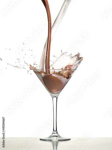 macro shoot with hot chocolate falling in glass on white in studio