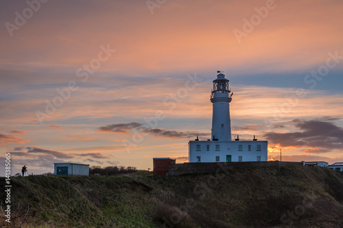Sunset at Flamborough Head Lighthouse / Flamborough Head is an eight mile long promontory on the Yorkshire coastline. It is a chalk headland, with sheer white cliffs