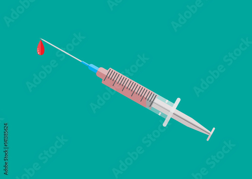 Medical plastic syringe with red liquid.