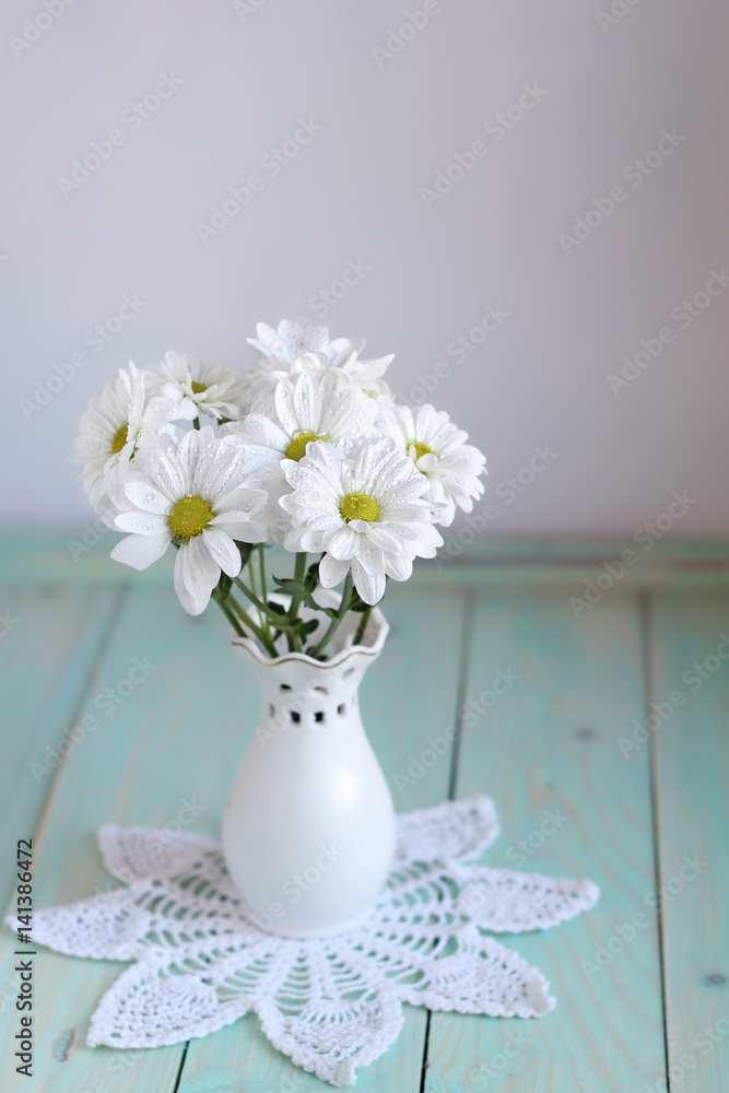 Still life with white chrysanthemums in vase on table background. floral gift. composition with flowers. template for design Still life with white chrysanthemums in vase on table background. floral gift. composition with flowers. template for design