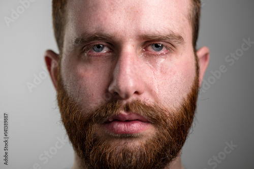 Fotografering Close Up of a Crying Man with Red Beard