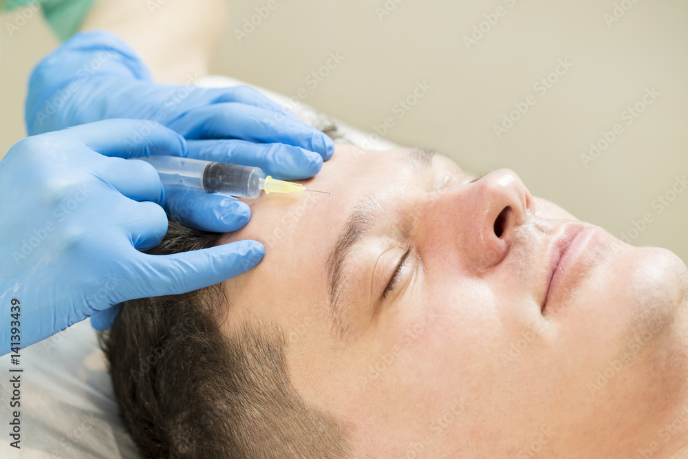 Man passes a course of mesotherapy clinic Man passes a course of mesotherapy clinic