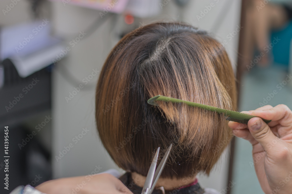 Healthy hair tips. Cropped shot of a female client receiving a haircut at  the local beauty salon Stock Photo | Adobe Stock