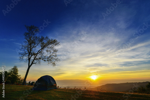 Watching the sunset in tent.