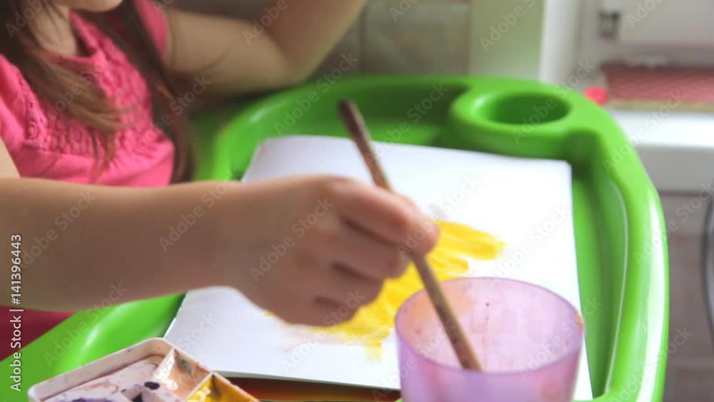 Little girl draws the sun Little girl draws the sun