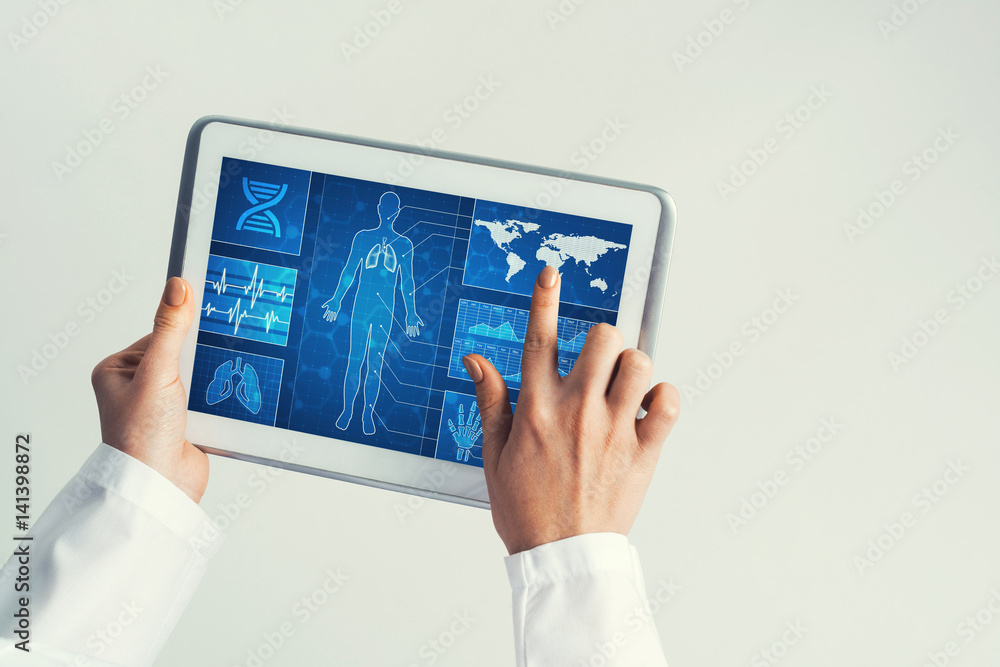 Close of female doctor hands working with tablet pc computer Close of female doctor hands working with tablet pc computer