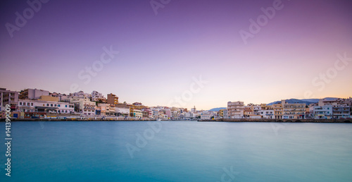 Agios Nikolaos, a picturesque coastal town with colorful buildings around the port in the eastern part of the island Crete, Greece