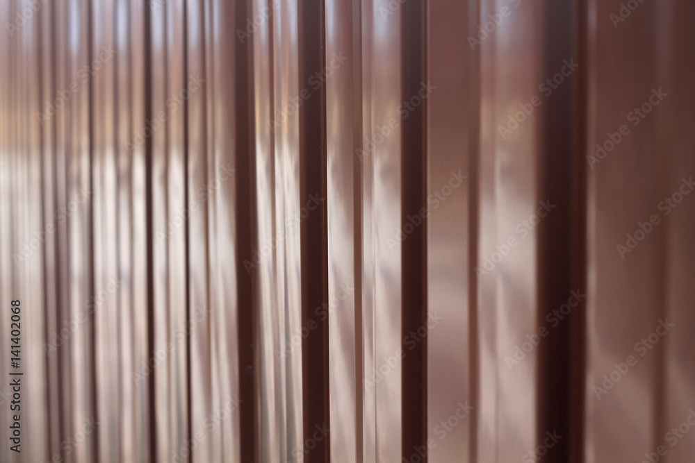 Obraz premium Background from metal profile sheet of chocolate color.