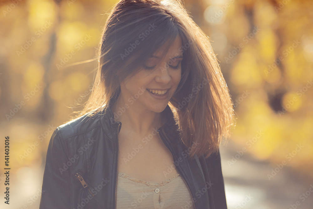 Young adult girl portrait in autumn park yellow leaves background Stock ...