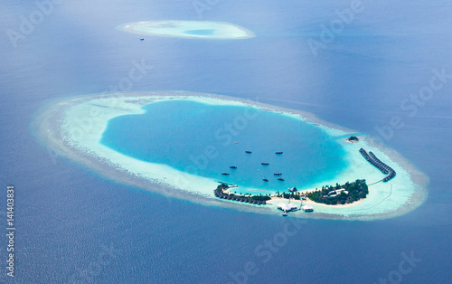 Aerial view from a seaplane of the Maldives atolls. photo