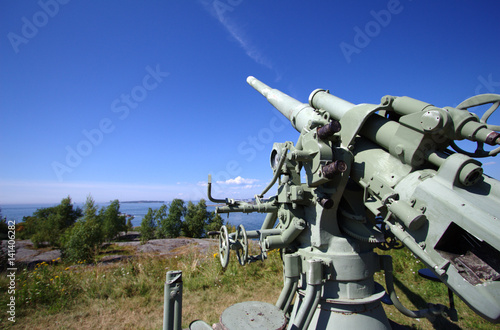 Historical air defense cannon in Suomenlinna. Sunny day with a clear sky.