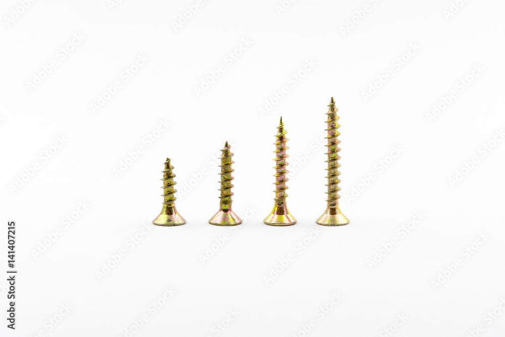 Closeup yellow zinc coated screw isolate on white background. Self Drilling screws. Isolated fasteners. Connecting material on white background. Silver and gold threads on bolts. Closeup yellow zinc coated screw isolate on white background. Self Drilling screws. Isolated fasteners. Connecting material on white background. Silver and gold threads on bolts.