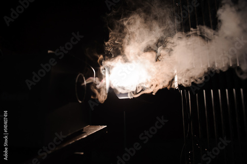 lights in smoke, studio lights shining through the smoke from smoke machine.