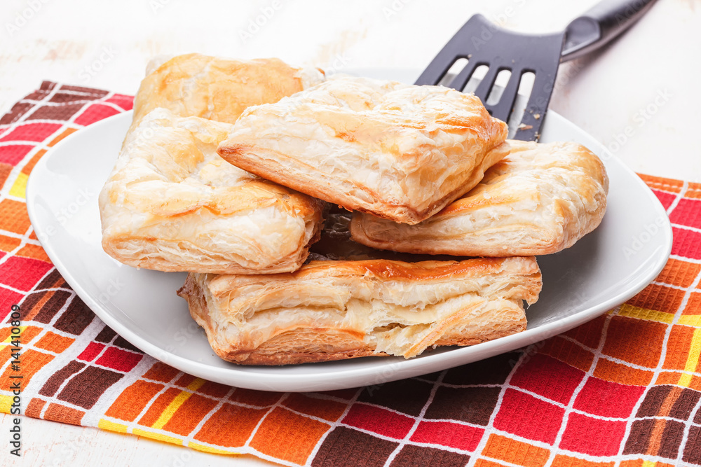 Puffs on a plate and a spatula Puffs on a plate and a spatula
