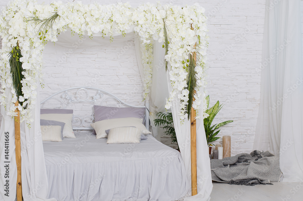 Εκτύπωση καμβά White bedroom with bed curtains and lot of flowers, and white textile on bed