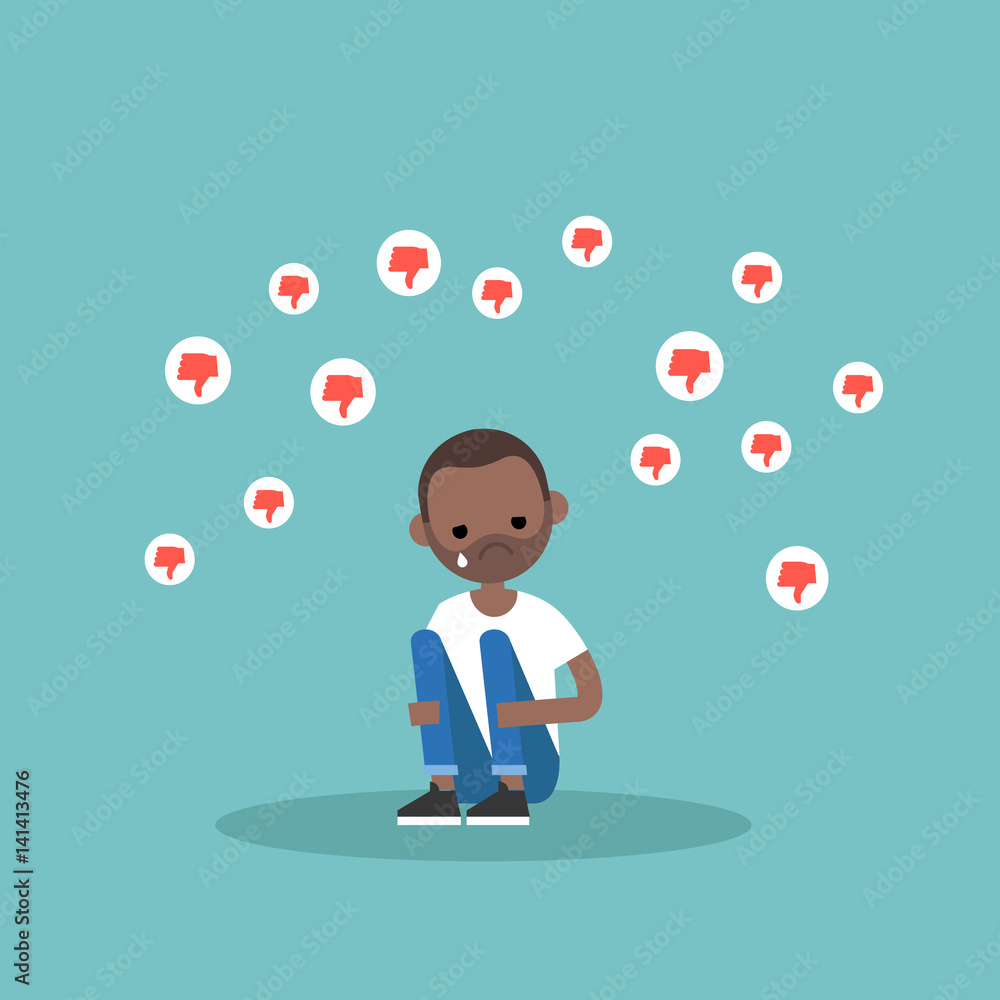 Upset crying black man sitting and hugging his knees surrounded by the dislike symbols / editable flat vector illustration, clip art