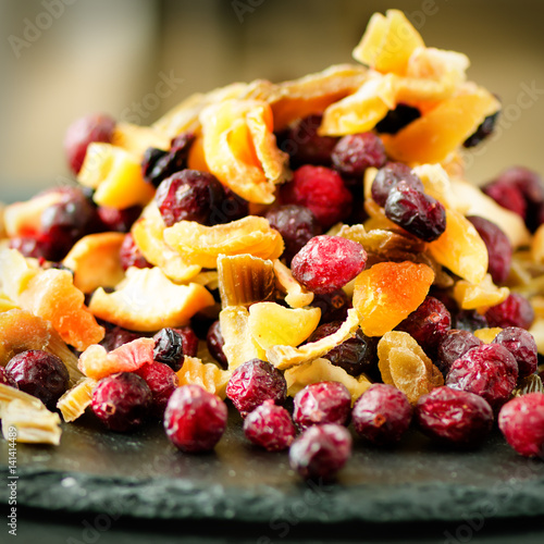 Mix of dried fruits on stone. Cranberry, rhubarb, apple, mango, cherry, peach, apricot. Handmade sweets no sugar. Healthy nutrition, high dose vitamin C.