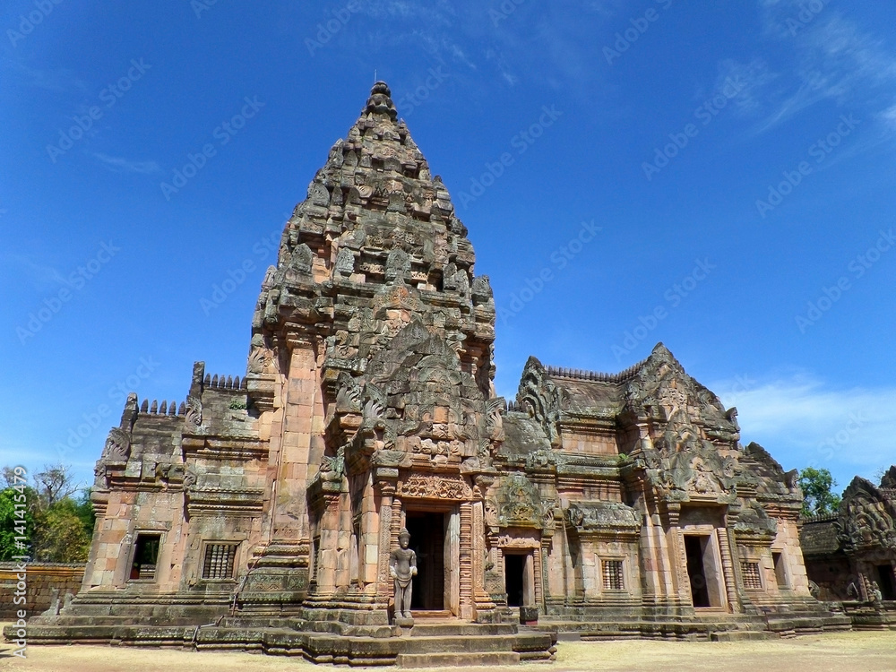Prasat Hin Phanom Rung against vibrant blue sky, well preserved ancient Khmer Temple in Buriram Province of Thailand