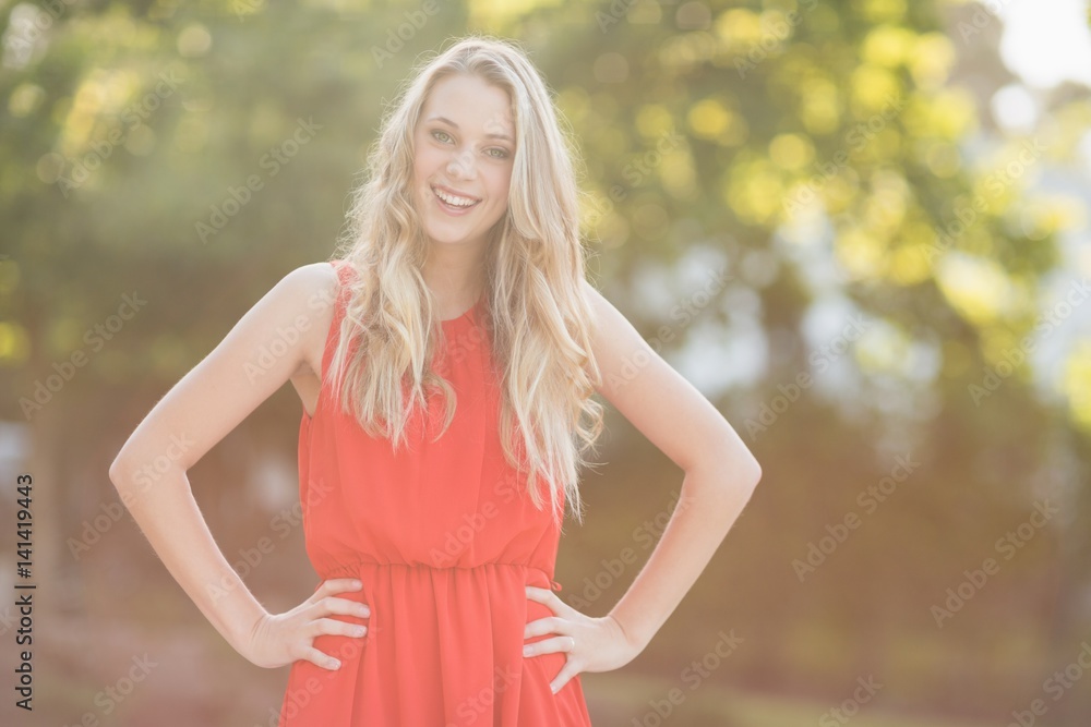 Beautiful woman standing with hands on her hip Beautiful woman standing with hands on her hip