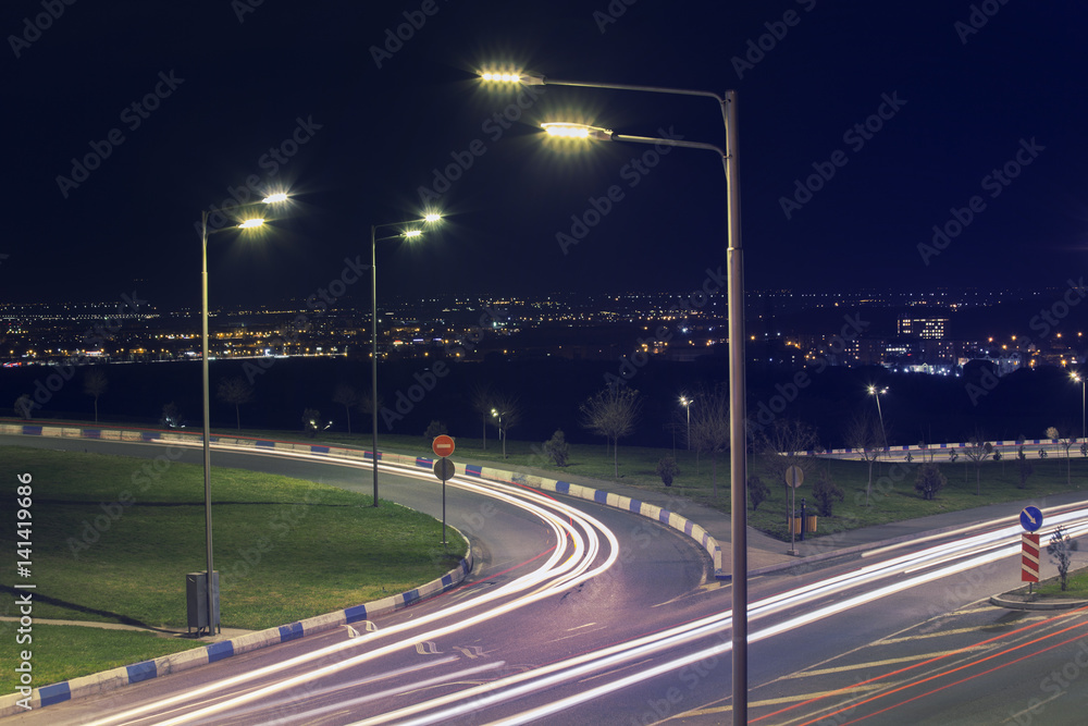 Long exposure photo of traffic with blurred traces from cars