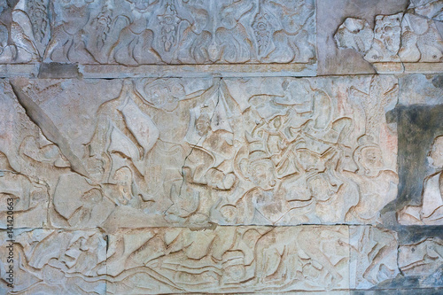 Stone Carving, all around on the wall at Angkor wat.