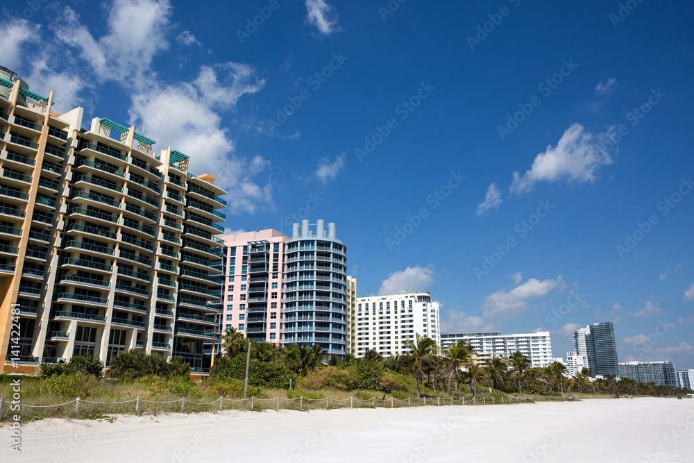 Hotels and condominiums line the white sandy Miami South Beach, Florida, USA.