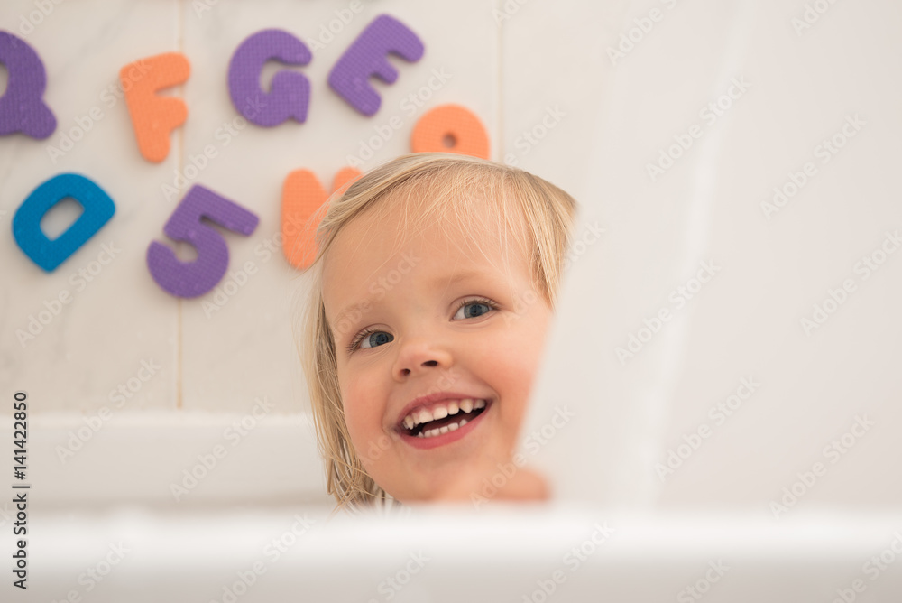 Smily little girl having fun in bath. Smily little girl having fun in bath.