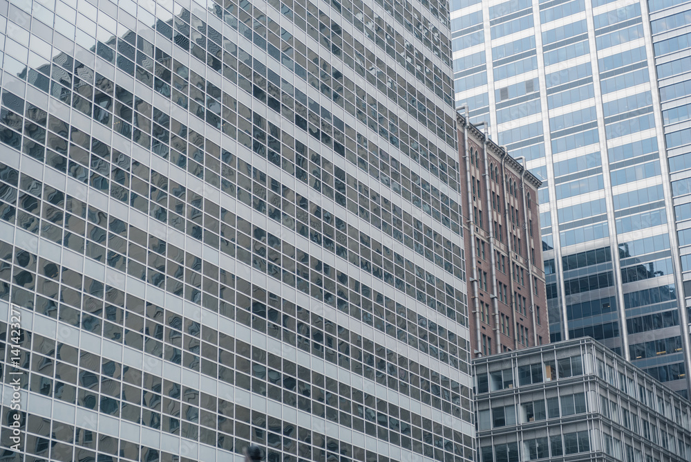 Different constructions mirroring in tall buildings Different constructions mirroring in tall buildings