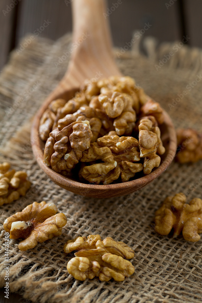 walnuts on wooden surface walnuts on wooden surface