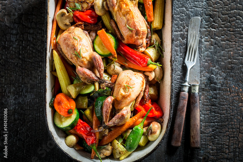 Roasted quails with vegetab...