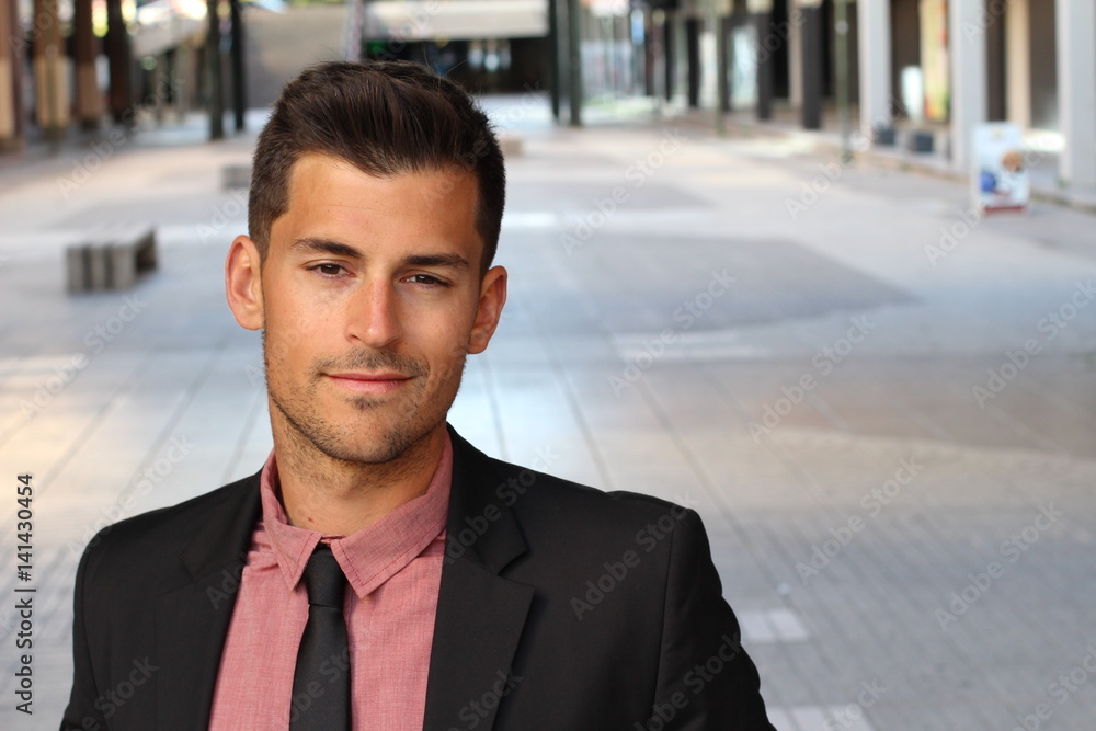 Confident handsome young businessman smiling Confident handsome young businessman smiling