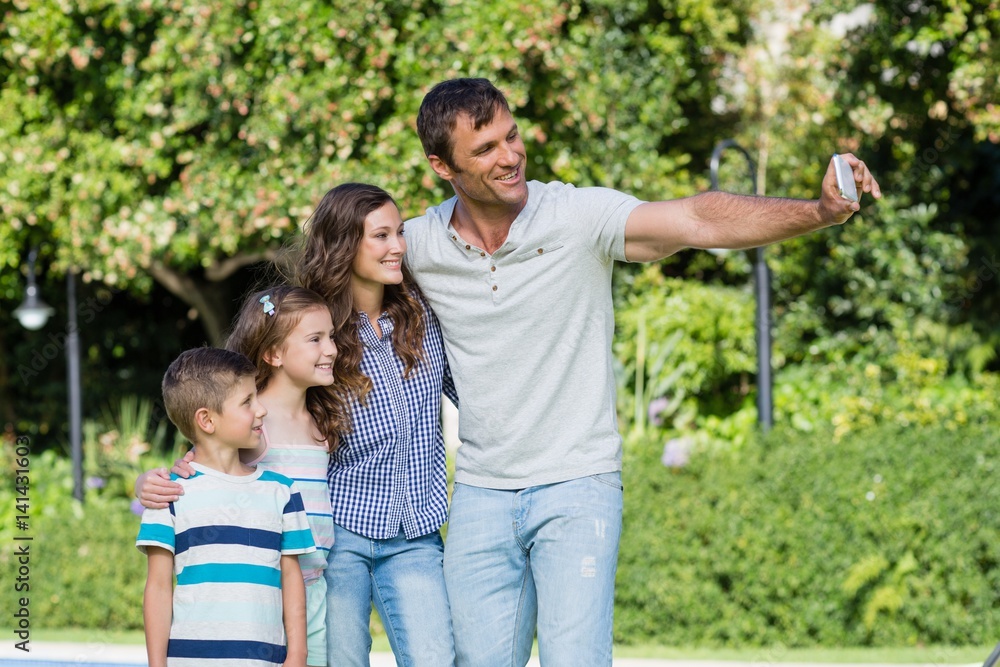 Happy family taking a selfie on mobile phone