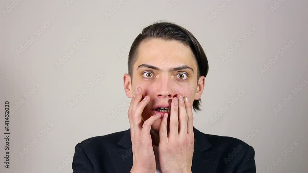 portrait of a young man was frightened. gesture portrait of a young man was frightened. gesture