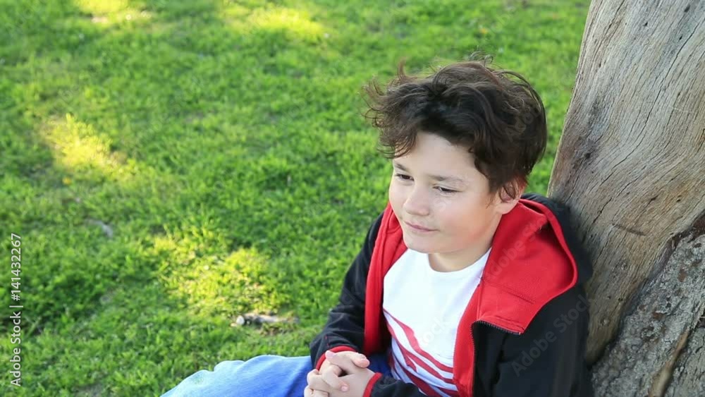 Portrait of young happy teen boy looking at camera and smiling at the outdoors Portrait of young happy teen boy looking at camera and smiling at the outdoors