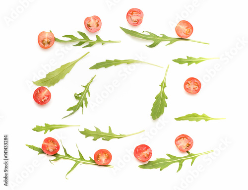 fresh vegetable, cherry tomato and green arugula isolated on white