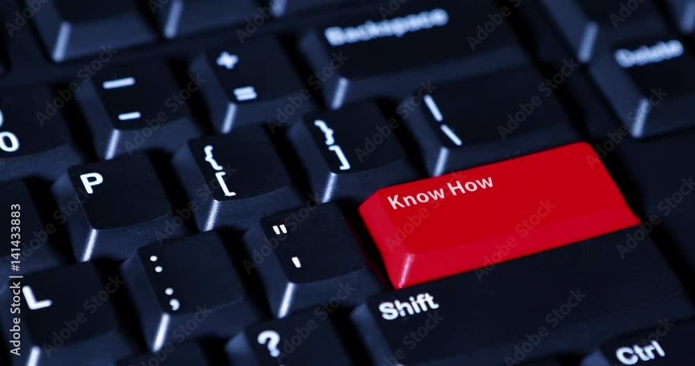 Human finger pushing a red button with text of Know How on the computer keyboard Human finger pushing a red button with text of Know How on the computer keyboard