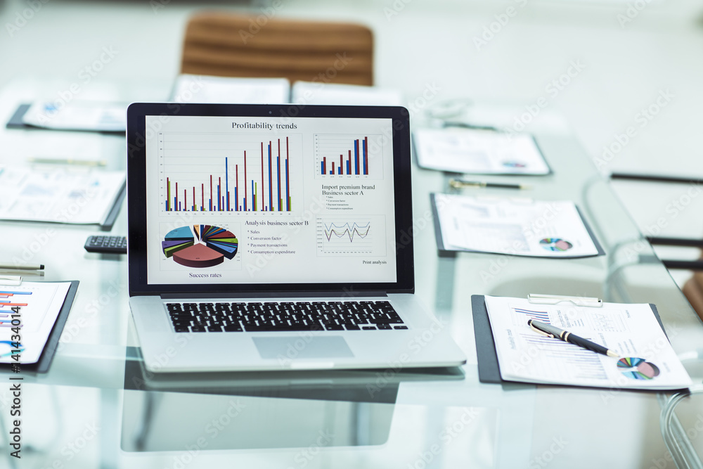 financial graph on the screen of the laptop in the workplace of the financier financial graph on the screen of the laptop in the workplace of the financier
