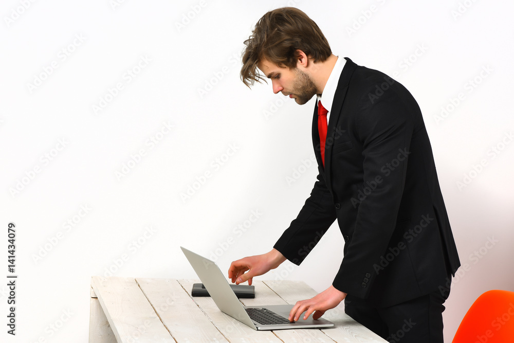 Caucasian stylish business man working with laptop Caucasian stylish business man working with laptop