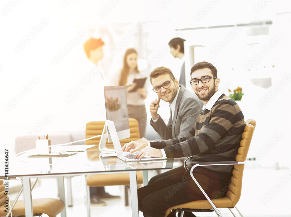 professional business team working on a presentation of a new advertising project. professional business team working on a presentation of a new advertising project.