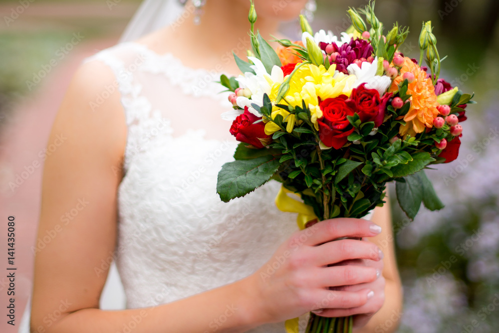 Beautiful wedding bouquet hands of the bride Beautiful wedding bouquet hands of the bride