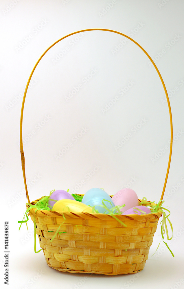 Yellow Easter Basket with Colrful Easter Eggs inside Yellow Easter Basket with Colrful Easter Eggs inside