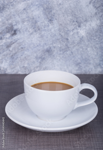 coffee on wood table and wall background