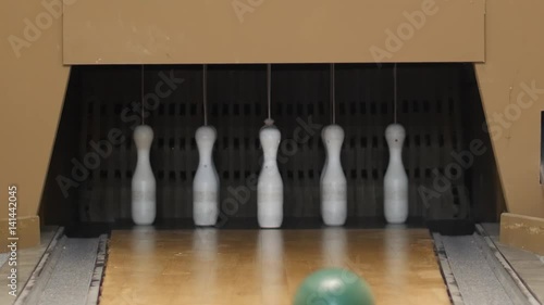Bowling ball going into the pins. Nine Pin Bowling