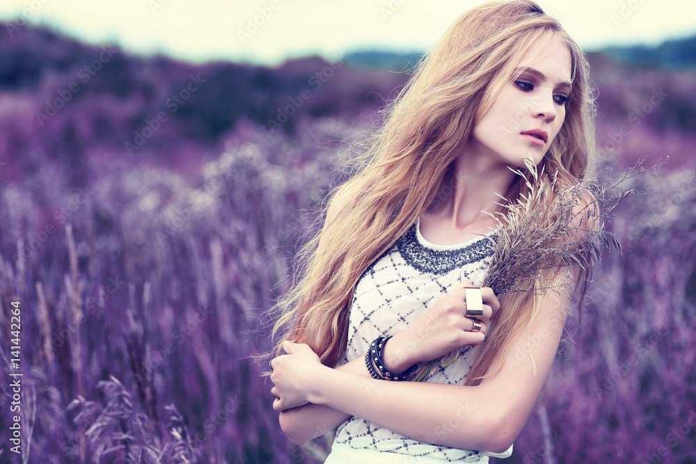 Fototapeta premium Beautiful romantic woman in the field.