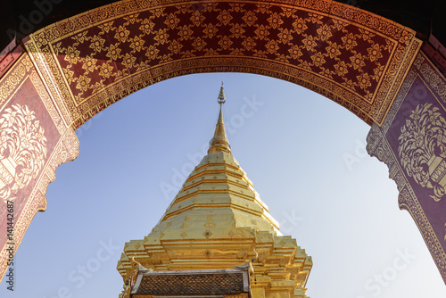 The golden pagoda from the door scene at the Pra that Doi Suthep Temple. photo