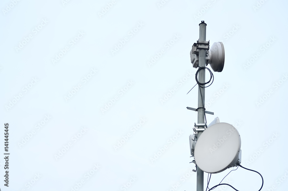 Close up of telecommunication tower in town Close up of telecommunication tower in town