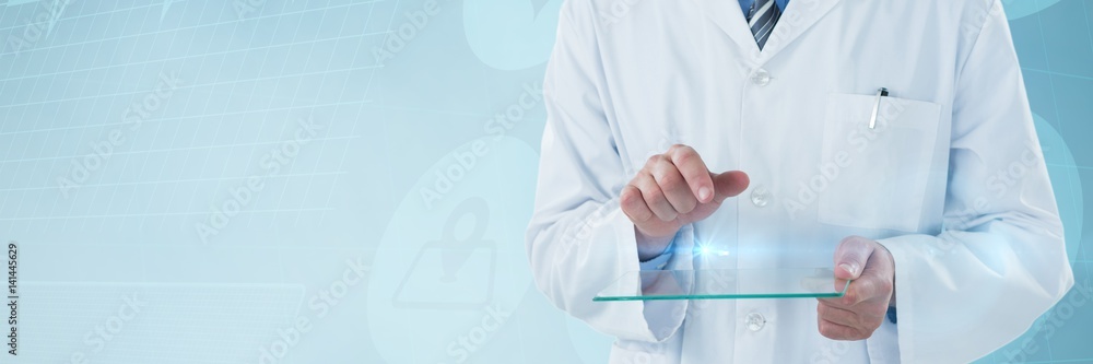 Composite image of male doctor using futuristic glass Composite image of male doctor using futuristic glass