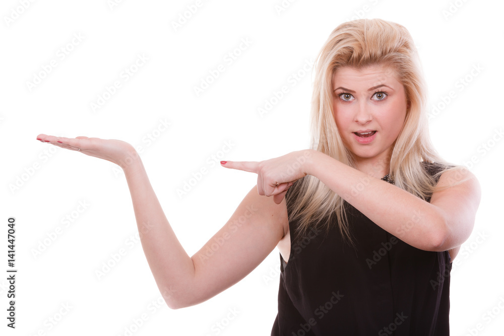 Fototapeta premium Blonde woman pointing with hands at copyspace