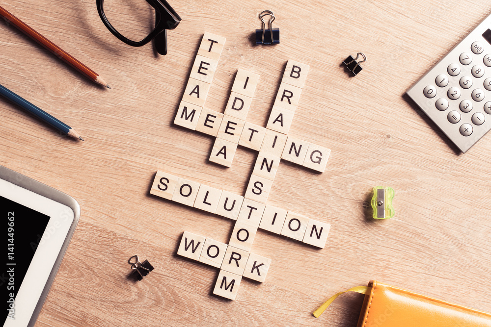 Conceptual business keywords on table with elements of game maki Conceptual business keywords on table with elements of game maki